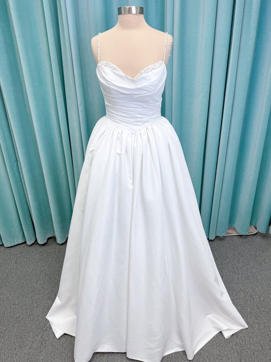 Morilee 1010003 Eleve A-line wedding dress on mannequin with scoop neckline, Chantilly lace peek-a-boo detail, beaded straps, and lace-up corset back