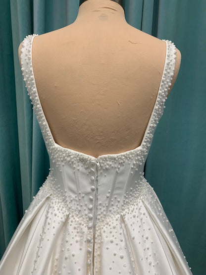 Essense of Australia D4418 Mikado ballgown with draped square neckline, ruched bodice, cascading pearl straps, and full pleated skirt
