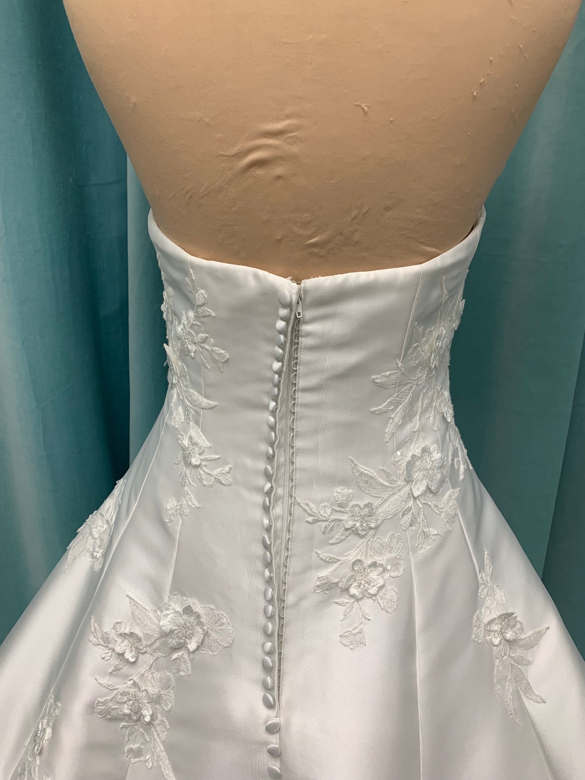 Strapless Mikado A-line wedding dress with straight neckline, lace detailing, and full skirt with hip volume by Essense of Australia Style D4479