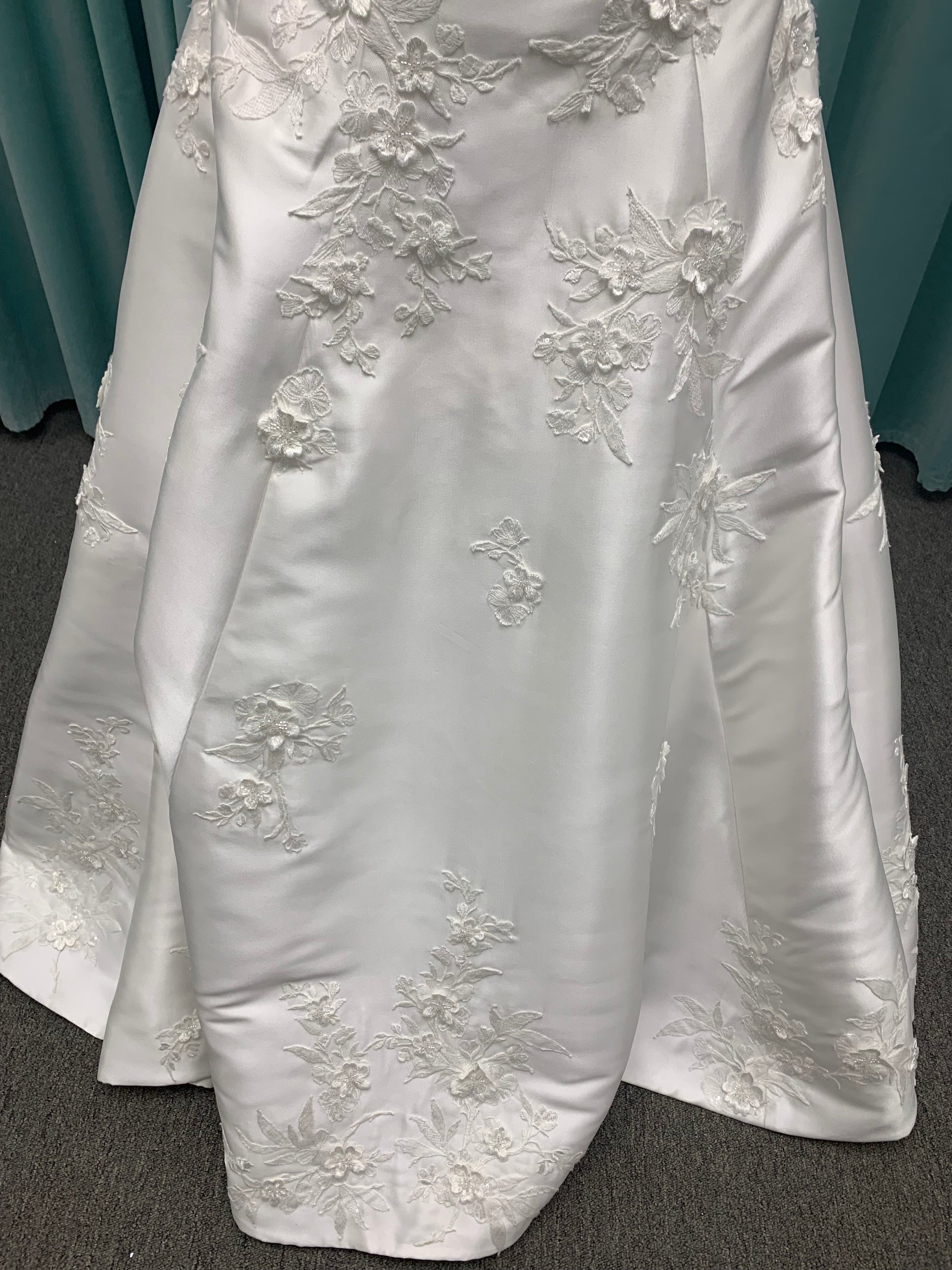 Strapless Mikado A-line wedding dress with straight neckline, lace detailing, and full skirt with hip volume by Essense of Australia Style D4479
