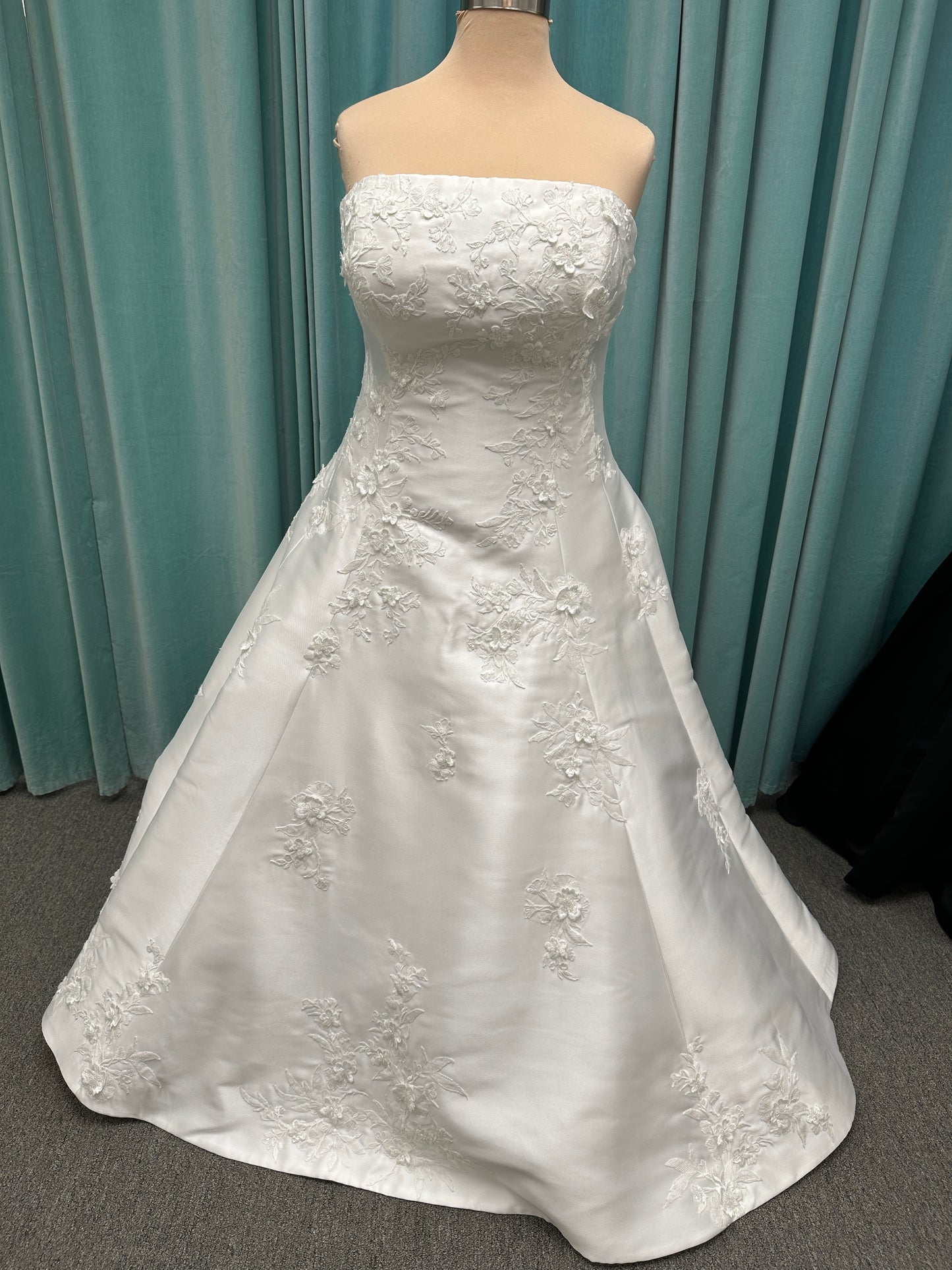 Plus Size Strapless Mikado A-line wedding dress with straight neckline, lace detailing, and full skirt with hip volume by Essense of Australia Style D4479