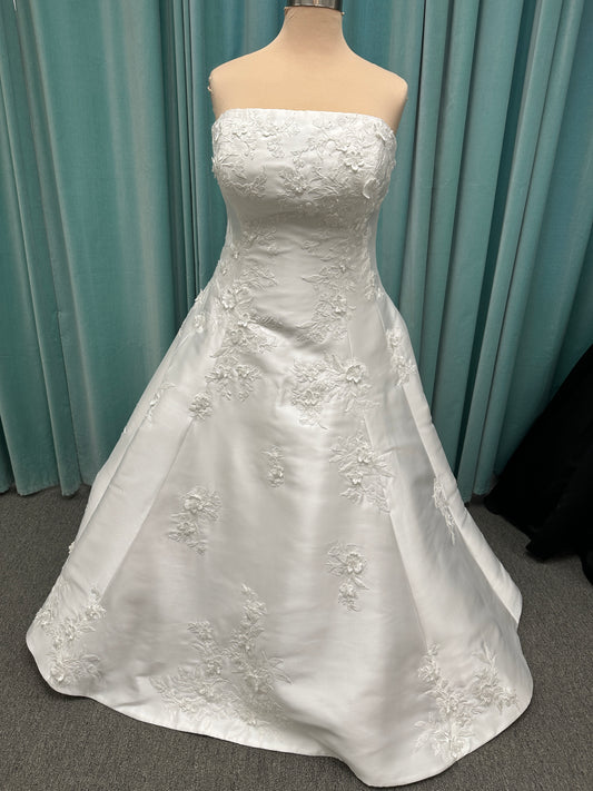 Plus Size Strapless Mikado A-line wedding dress with straight neckline, lace detailing, and full skirt with hip volume by Essense of Australia Style D4479