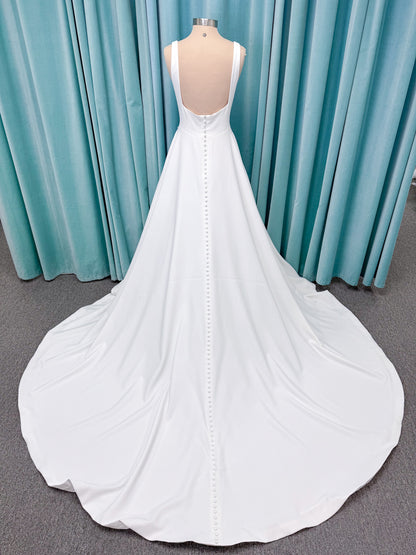 A-Line Ivory wedding dress on mannequin with square neckline and matte crepe A-line skirt