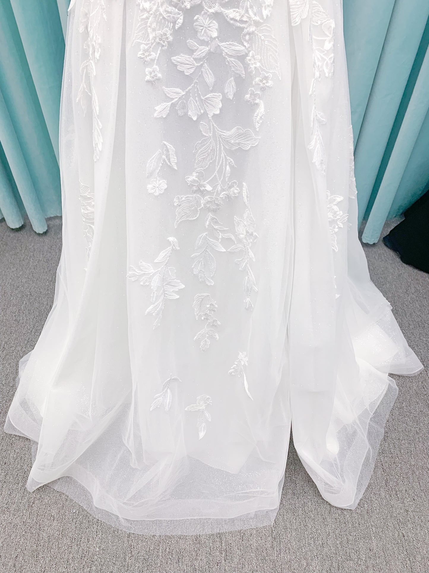 Morilee 2979 Filippa A-line wedding dress in glitter tulle with plunge sweetheart bodice, sequin beaded threadwork appliqués, detachable off-shoulder straps, and front slit.