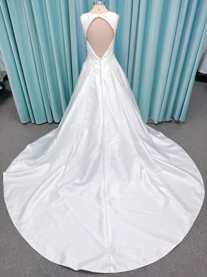 Morilee 1050018 Glissade A-line wedding dress on mannequin with high neckline, 3D floral lace appliques, satin, and beading