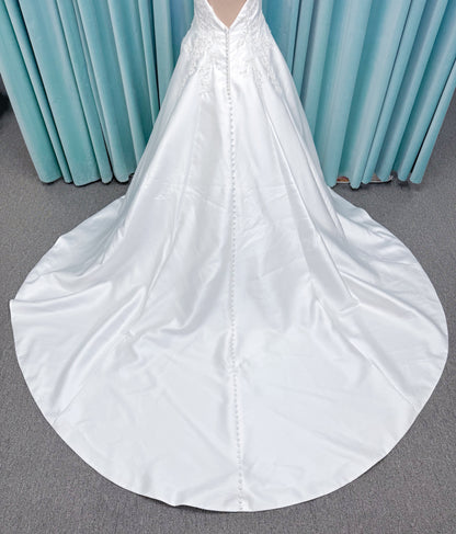 Morilee 1050018 Glissade A-line wedding dress on mannequin with high neckline, 3D floral lace appliques, satin, and beading