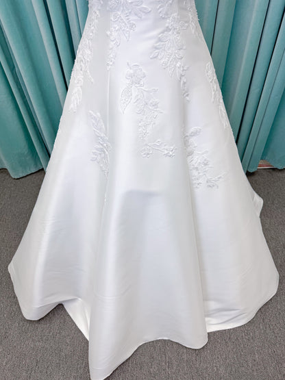 Morilee 1010037 Isadora A-line wedding dress on mannequin with strapless cuffed neckline, princess seams, and beaded Mikado lace