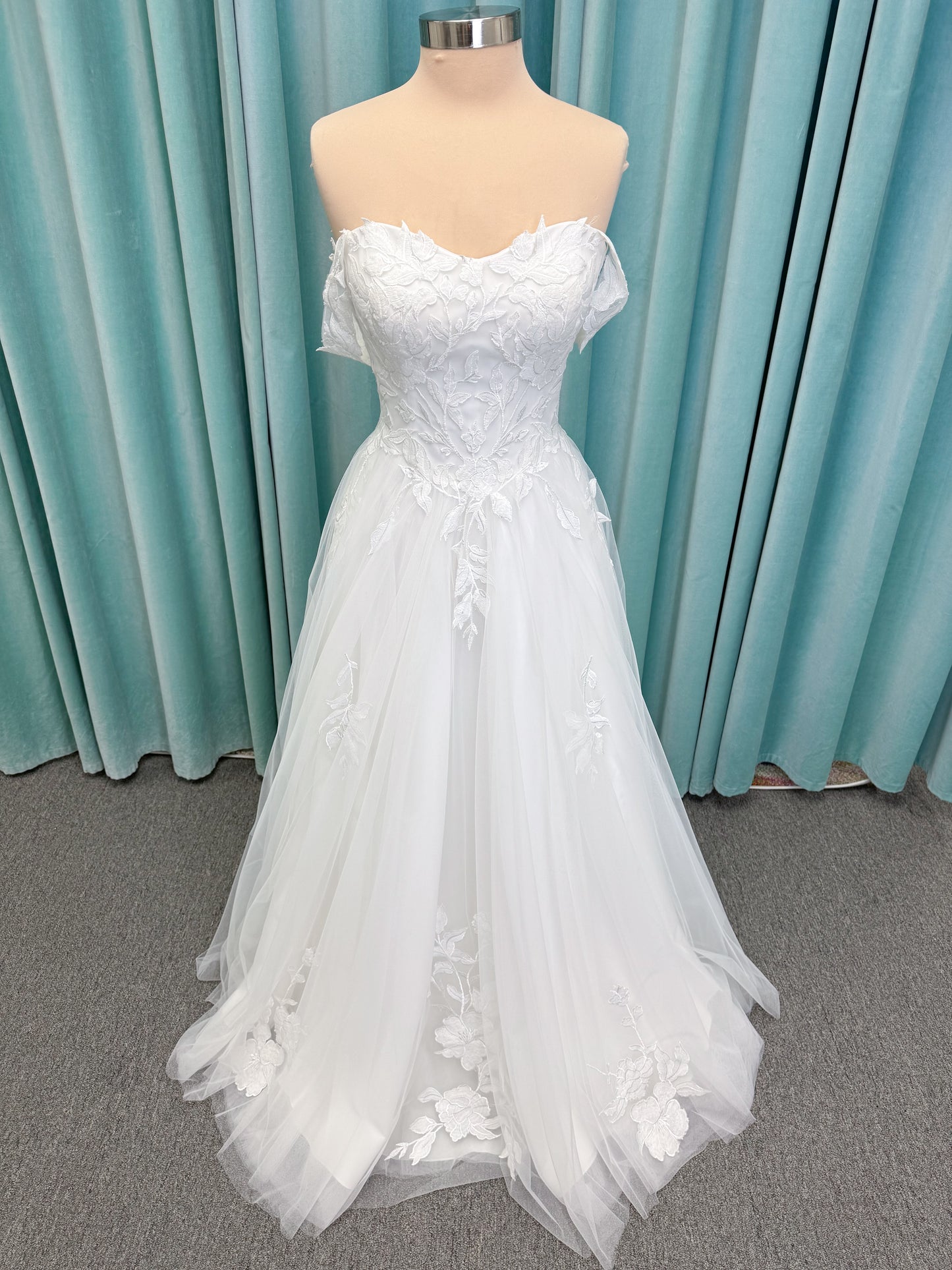 Jeslyn A-line Wedding Dress in Ivory, Size 14 — off-the-shoulder, floral appliqués cascading through tulle