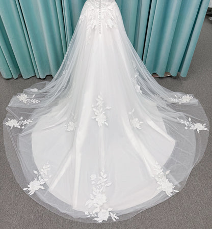 Jeslyn A-line Wedding Dress in Ivory, Size 14 — off-the-shoulder, floral appliqués cascading through tulle