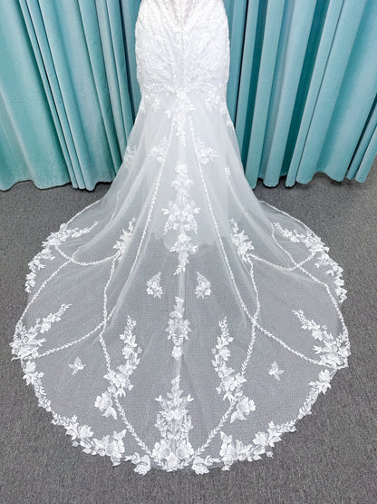 Randy Fenoli Jillian fit and flare wedding dress on mannequin with strapless sweetheart neckline, beaded lace appliqué, detachable off-the-shoulder straps, and glitter tulle skirt