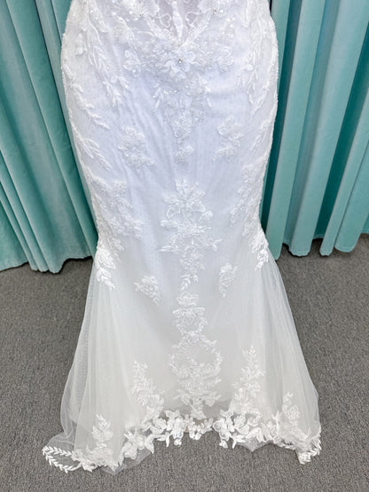 Randy Fenoli Jillian fit and flare wedding dress on mannequin with strapless sweetheart neckline, beaded lace appliqué, detachable off-the-shoulder straps, and glitter tulle skirt