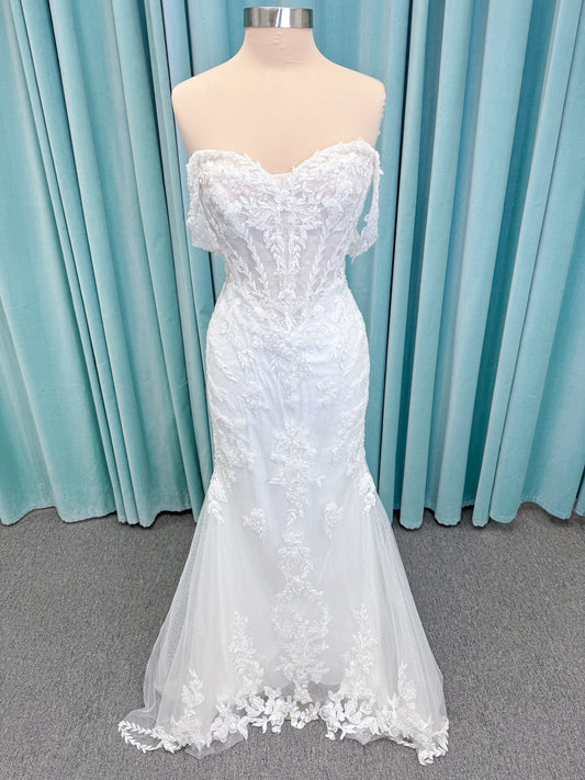 Randy Fenoli Jillian fit and flare wedding dress on mannequin with strapless sweetheart neckline, beaded lace appliqué, detachable off-the-shoulder straps, and glitter tulle skirt