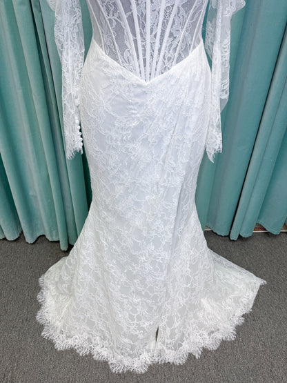 Morilee 2983 Leto fit and flare wedding dress with scoop neckline, lace corset bodice, glitter tulle, detachable draped sleeves, thigh-high slit, and sweeping train.