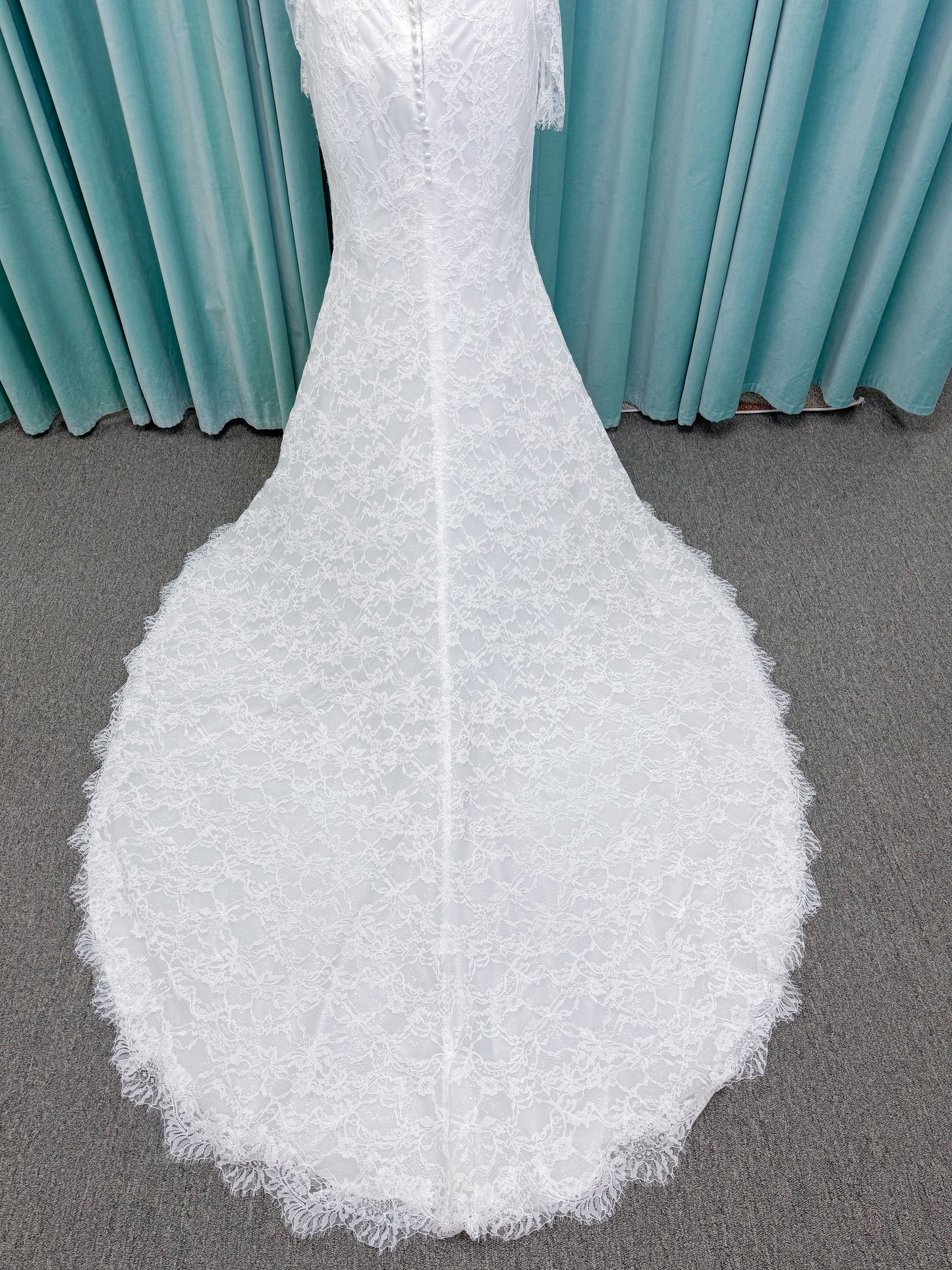 Morilee 2983 Leto fit and flare wedding dress with scoop neckline, lace corset bodice, glitter tulle, detachable draped sleeves, thigh-high slit, and sweeping train.