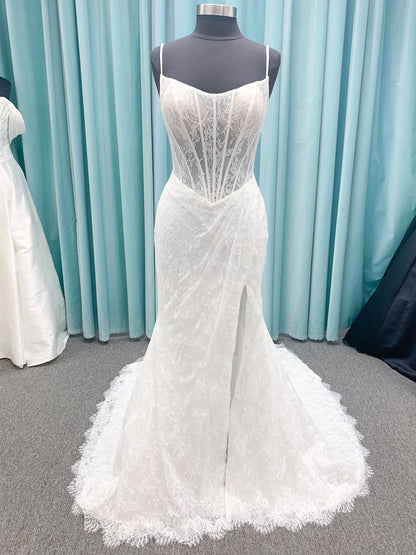 Morilee 2983 Leto fit and flare wedding dress with scoop neckline, lace corset bodice, glitter tulle, detachable draped sleeves, thigh-high slit, and sweeping train.
