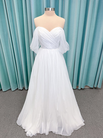 Morilee 2910L Levana A-line wedding dress on mannequin with sweetheart strapless neckline, off-the-shoulder sleeves, draped organza bodice, and beaded waistband