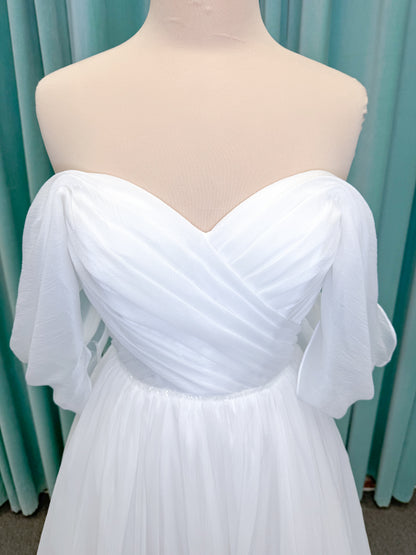Morilee 2910L Levana A-line wedding dress on mannequin with sweetheart strapless neckline, off-the-shoulder sleeves, draped organza bodice, and beaded waistband
