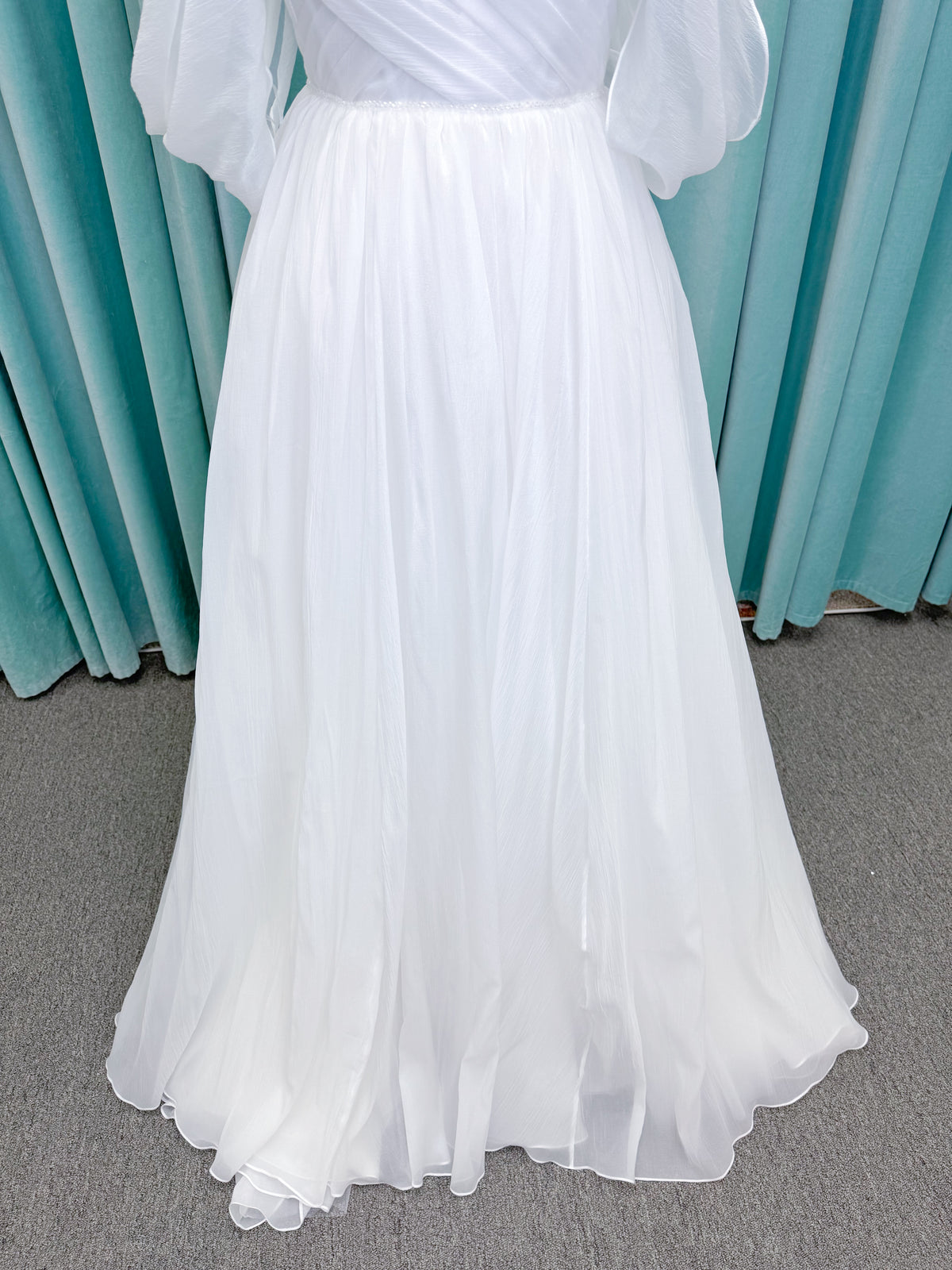 Morilee 2910L Levana A-line wedding dress on mannequin with sweetheart strapless neckline, off-the-shoulder sleeves, draped organza bodice, and beaded waistband