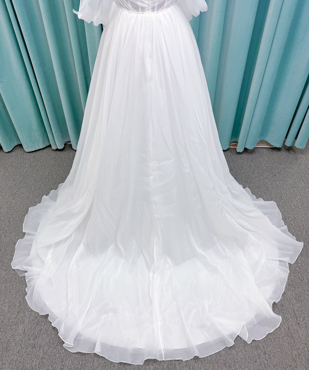 Morilee 2910L Levana A-line wedding dress on mannequin with sweetheart strapless neckline, off-the-shoulder sleeves, draped organza bodice, and beaded waistband