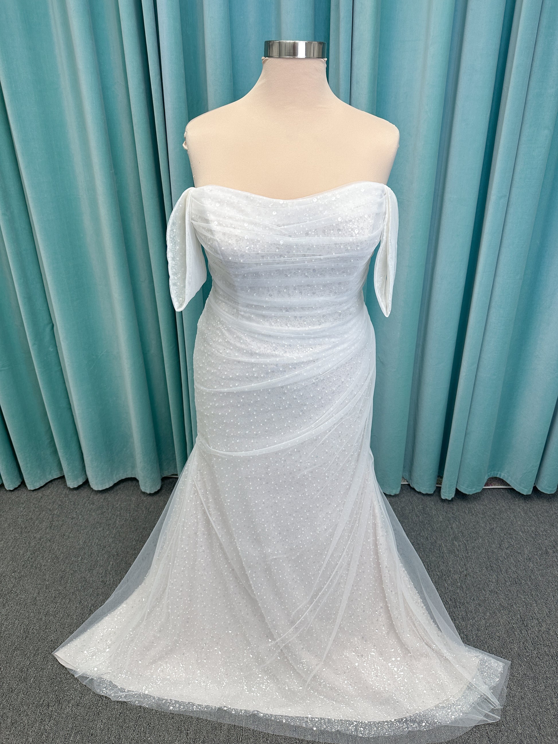 Morilee 3393 Lyrica fit and flare wedding dress in allover beaded net with draped tulle overlay, lace-up corset back, and detachable draped sleeves.