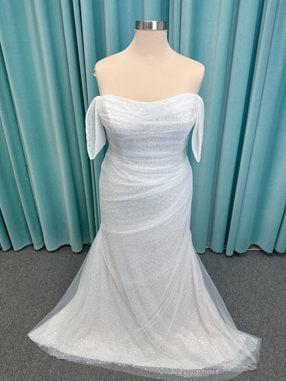 Morilee 3393 Lyrica fit and flare wedding dress in allover beaded net with draped tulle overlay, lace-up corset back, and detachable draped sleeves.