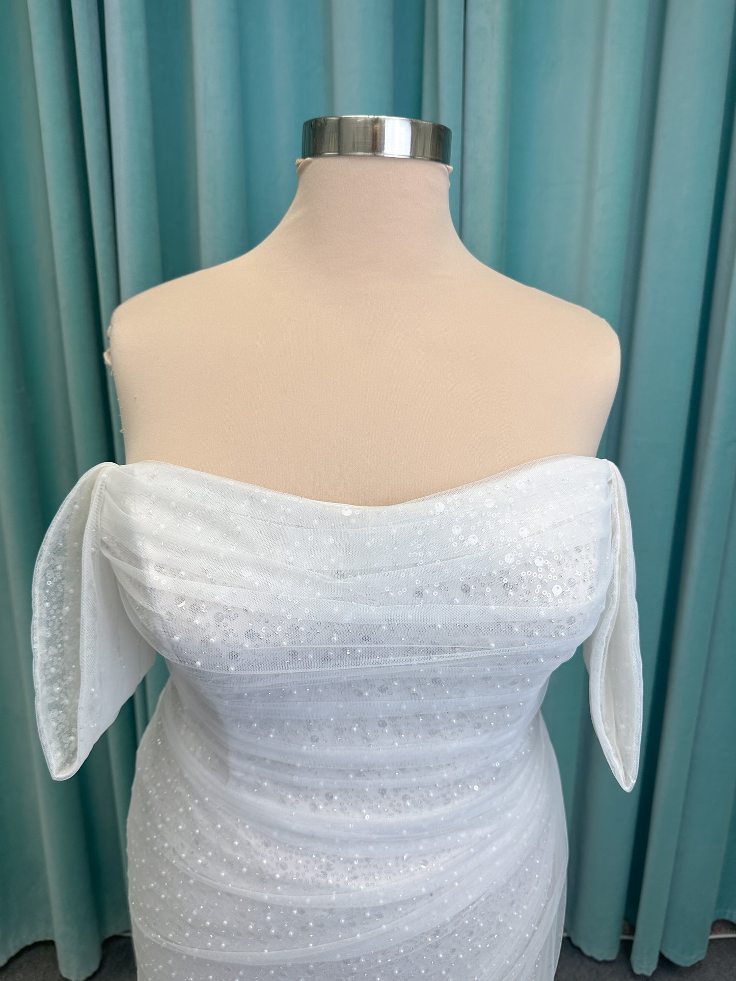 Morilee 3393 Lyrica fit and flare wedding dress in allover beaded net with draped tulle overlay, lace-up corset back, and detachable draped sleeves.