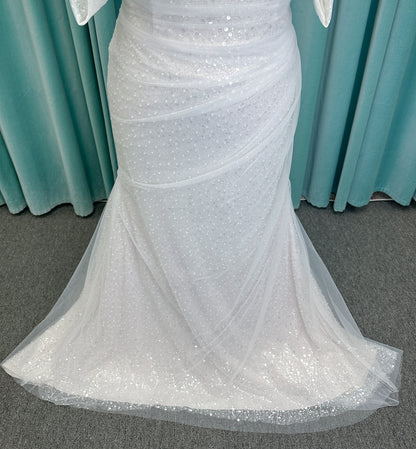 Morilee 3393 Lyrica fit and flare wedding dress in allover beaded net with draped tulle overlay, lace-up corset back, and detachable draped sleeves.