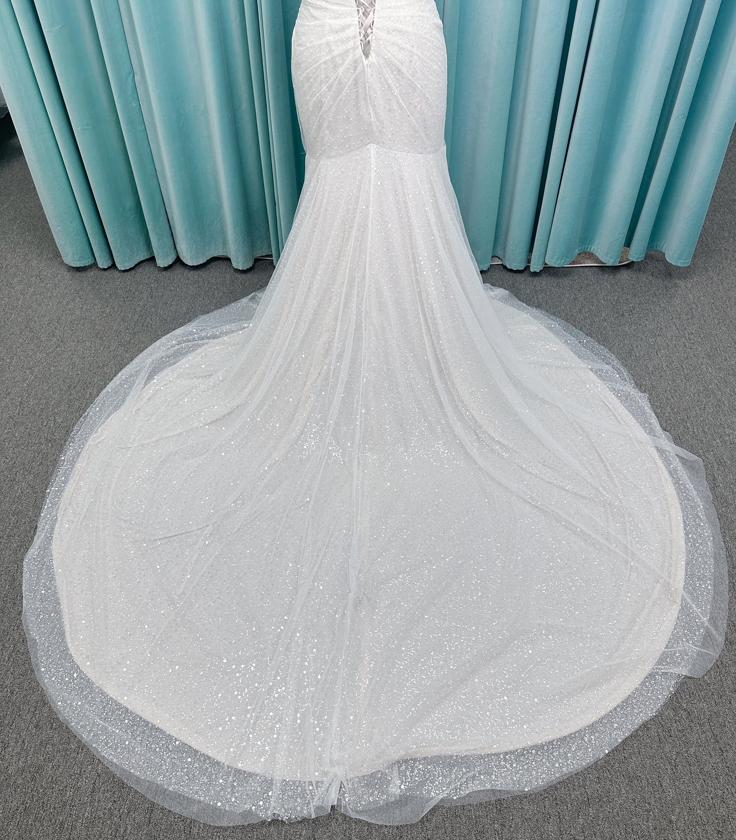 Morilee 3393 Lyrica fit and flare wedding dress in allover beaded net with draped tulle overlay, lace-up corset back, and detachable draped sleeves.