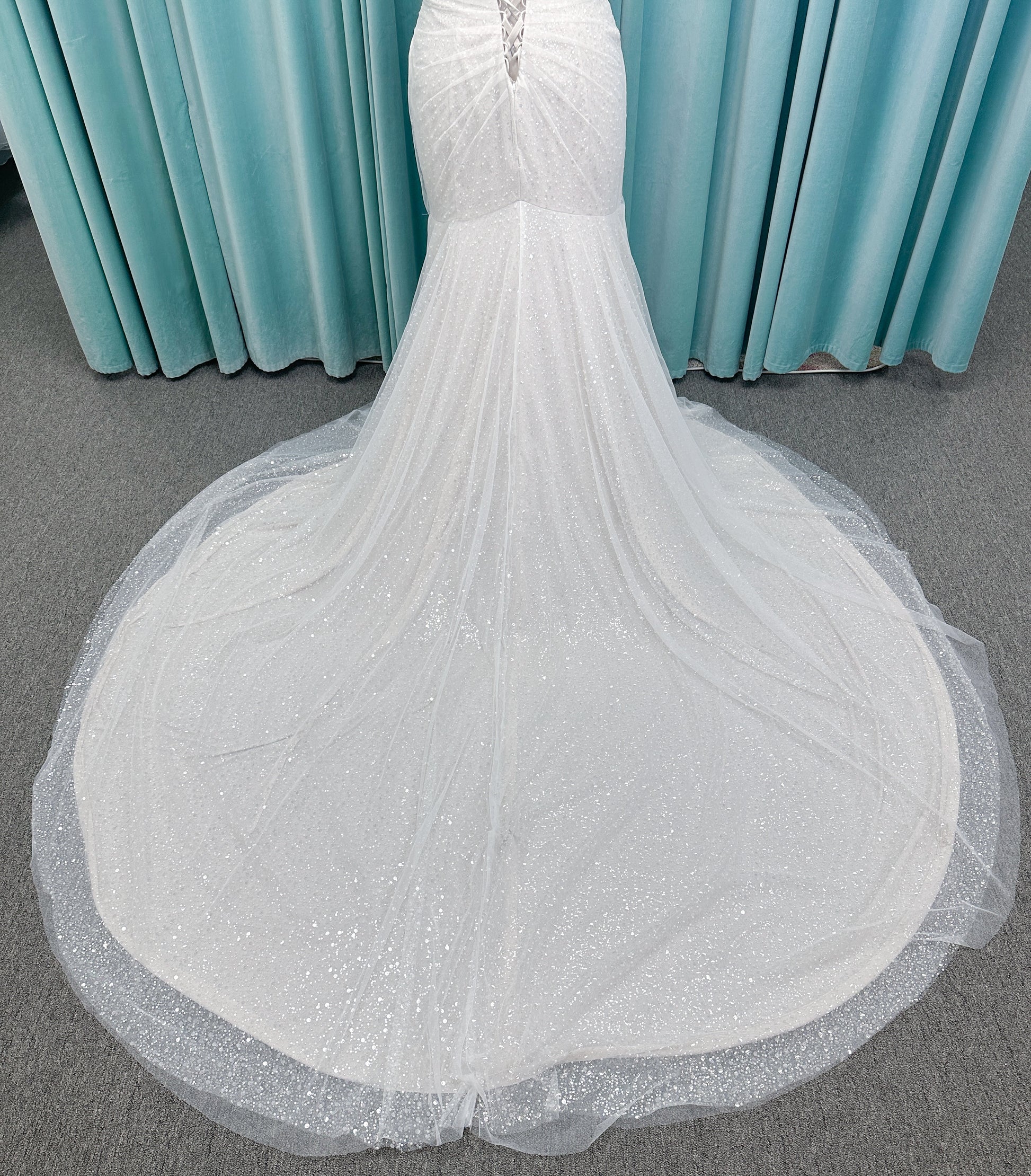 Morilee 3393 Lyrica fit and flare wedding dress in allover beaded net with draped tulle overlay, lace-up corset back, and detachable draped sleeves.