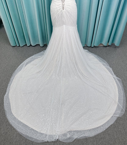 Morilee 3393 Lyrica fit and flare wedding dress in allover beaded net with draped tulle overlay, lace-up corset back, and detachable draped sleeves.