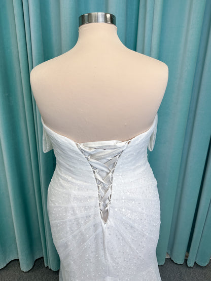 Morilee 3393 Lyrica fit and flare wedding dress in allover beaded net with draped tulle overlay, lace-up corset back, and detachable draped sleeves.