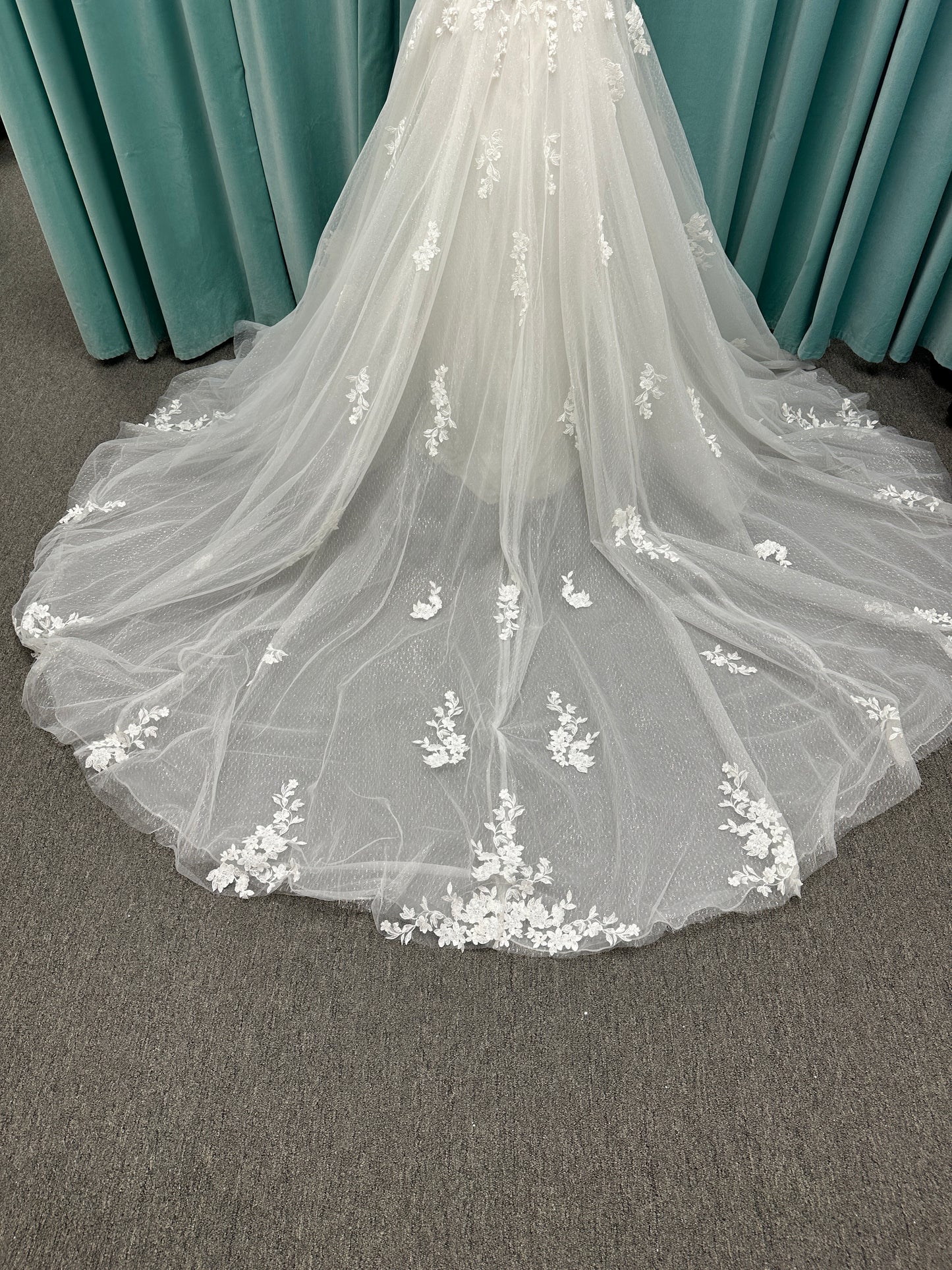 Off-the-shoulder lace A-line wedding dress with corset bodice, 3D floral appliqués, and glitter tulle skirt by Essense of Australia style D4360