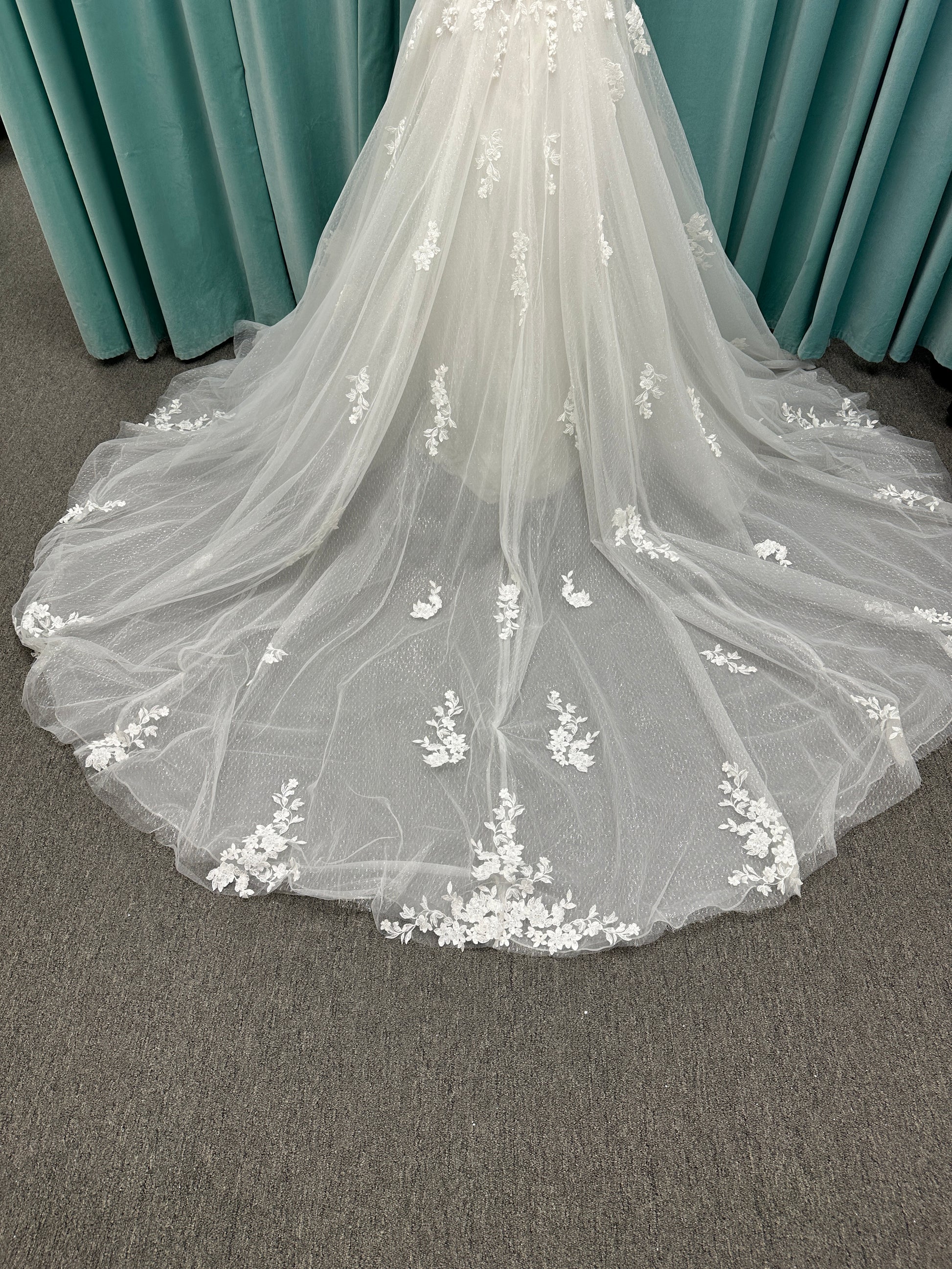 Off-the-shoulder lace A-line wedding dress with corset bodice, 3D floral appliqués, and glitter tulle skirt by Essense of Australia style D4360