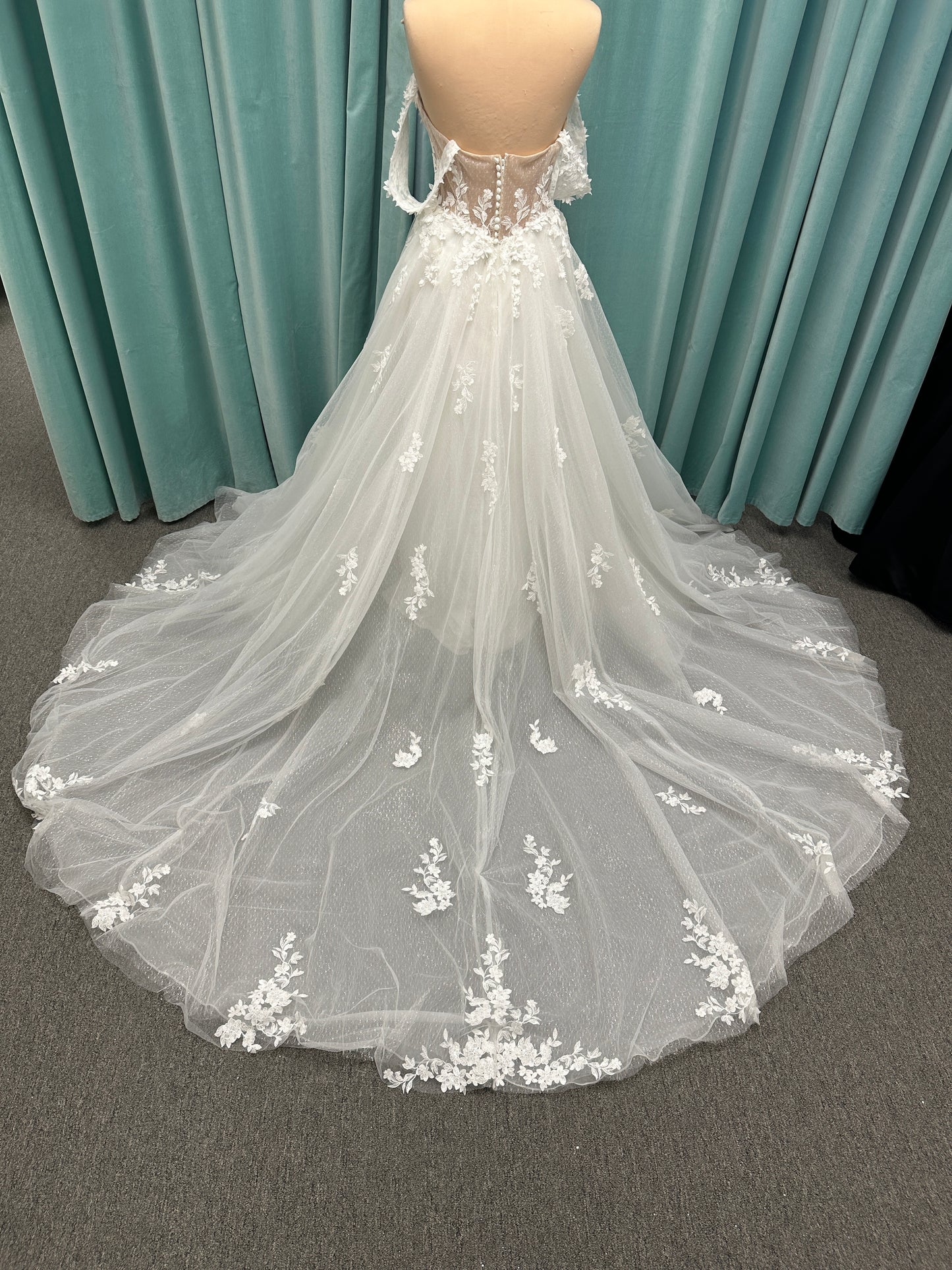 Off-the-shoulder lace A-line wedding dress with corset bodice, 3D floral appliqués, and glitter tulle skirt by Essense of Australia style D4360