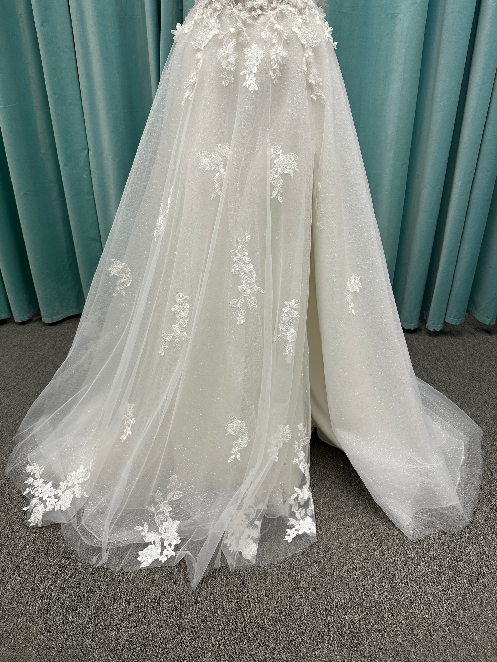 Off-the-shoulder lace A-line wedding dress with corset bodice, 3D floral appliqués, and glitter tulle skirt by Essense of Australia style D4360