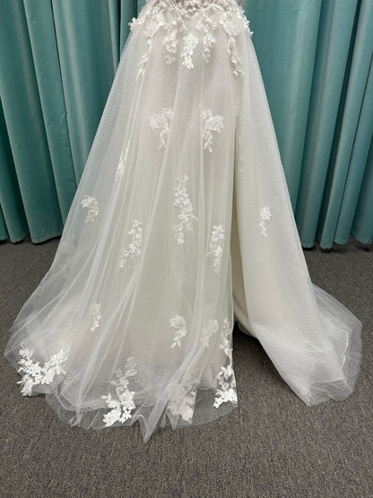 Off-the-shoulder lace A-line wedding dress with corset bodice, 3D floral appliqués, and glitter tulle skirt by Essense of Australia style D4360
