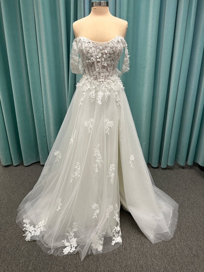 Off-the-shoulder lace A-line wedding dress with corset bodice, 3D floral appliqués, and glitter tulle skirt by Essense of Australia style D4360