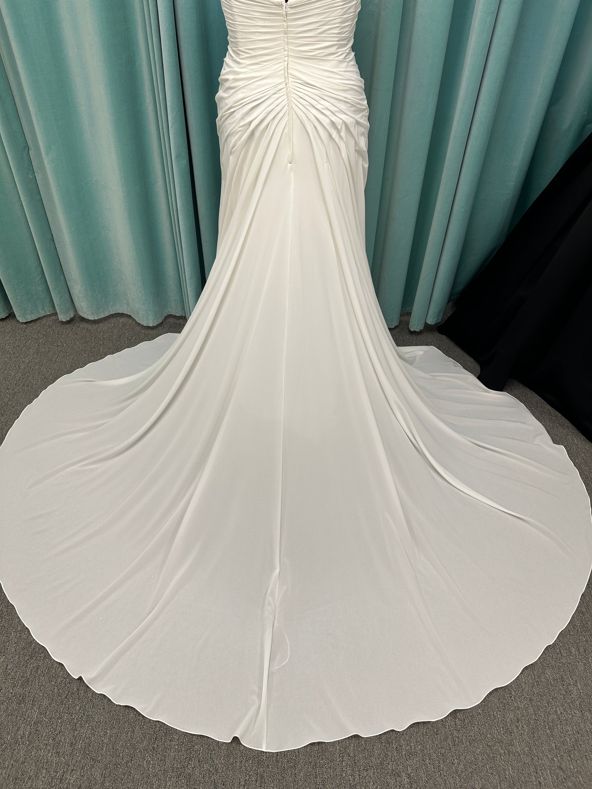 Plus size strapless chiffon A-line wedding dress with sweetheart neckline and draped bodice detail
