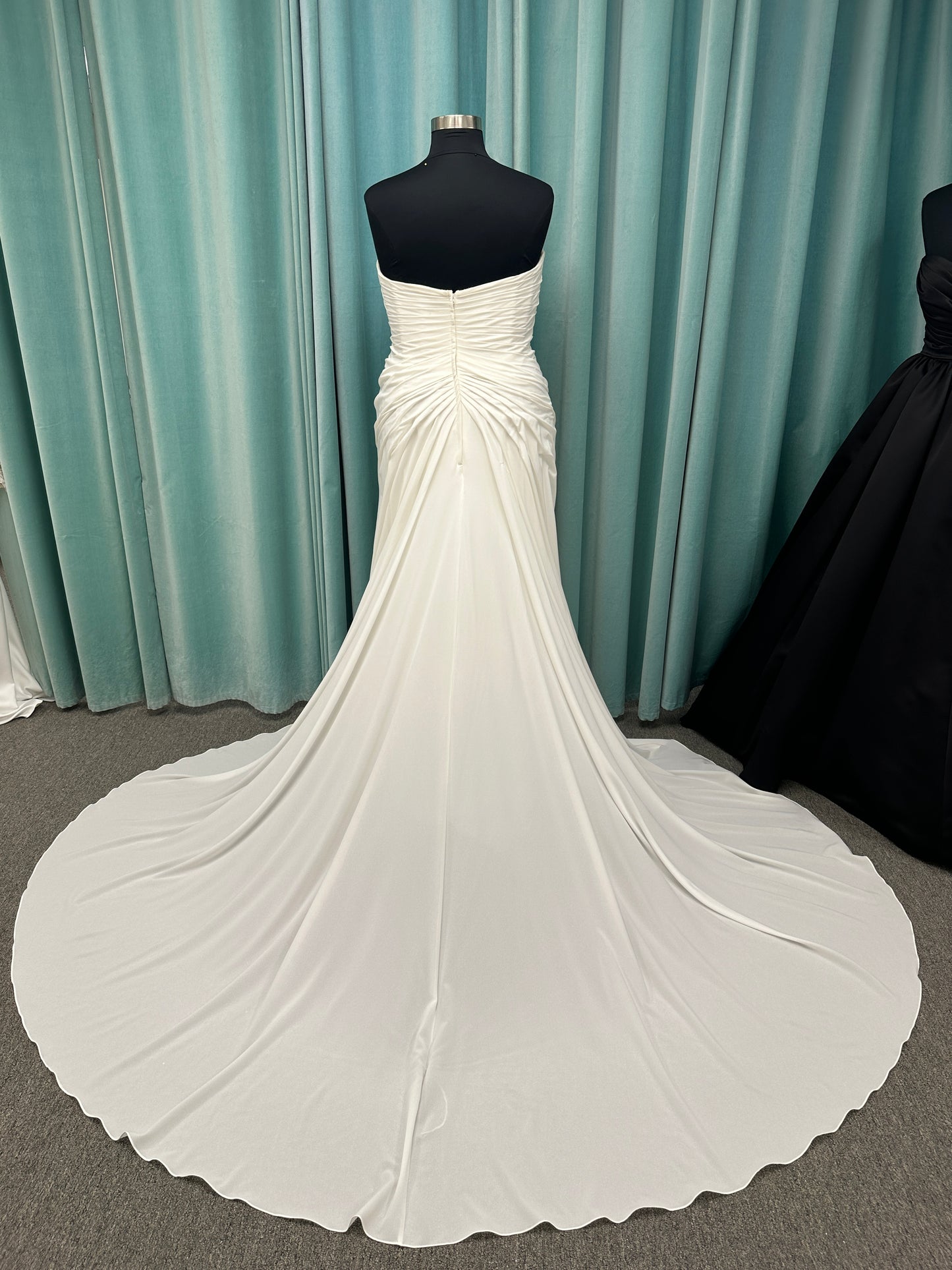 Plus size strapless chiffon A-line wedding dress with sweetheart neckline and draped bodice detail