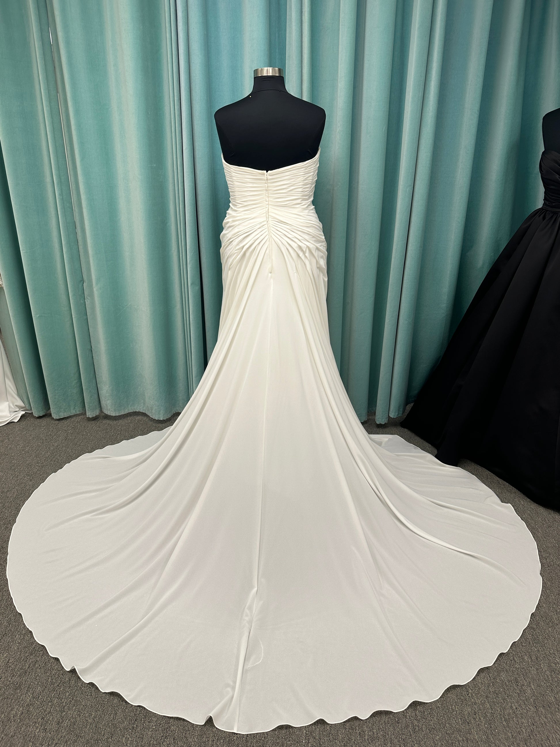 Plus size strapless chiffon A-line wedding dress with sweetheart neckline and draped bodice detail
