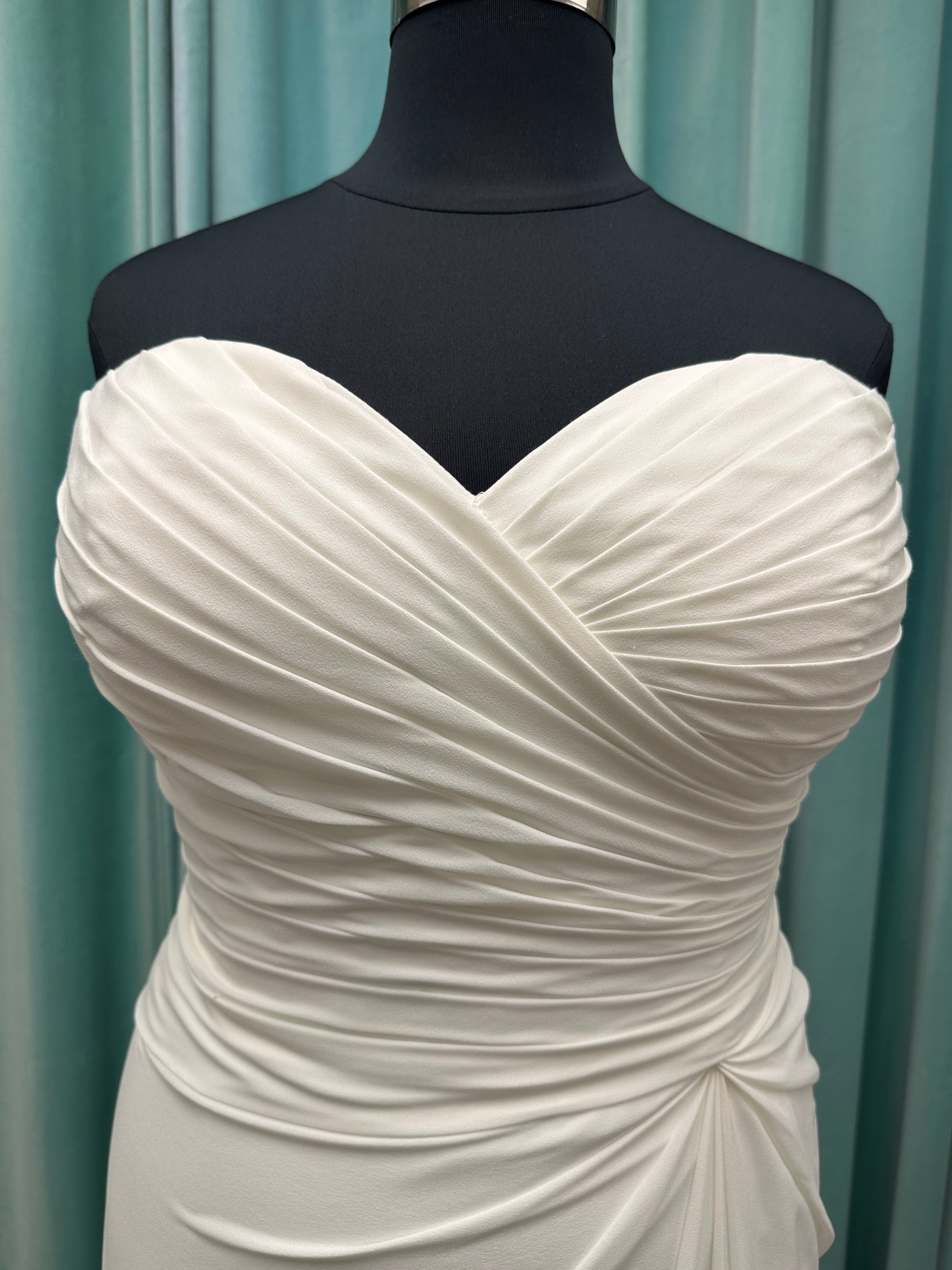 Plus size strapless chiffon A-line wedding dress with sweetheart neckline and draped bodice detail