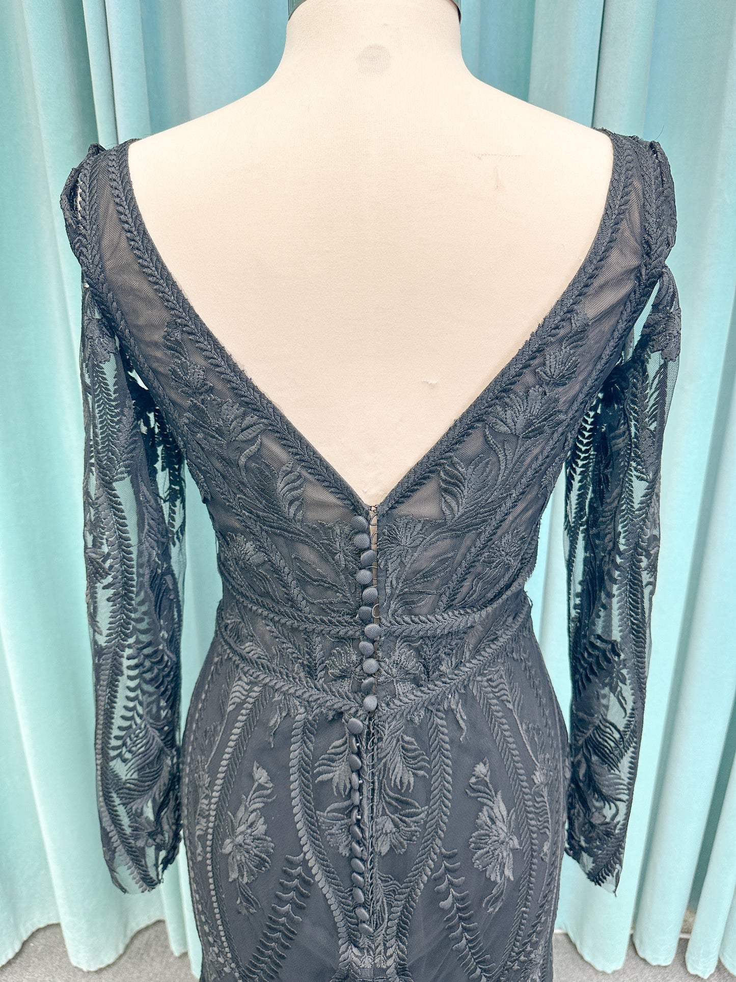Morticia Mermaid Wedding Dress in Black, Size 12 — embroidered lace, plunging V-neckline, long illusion sleeves