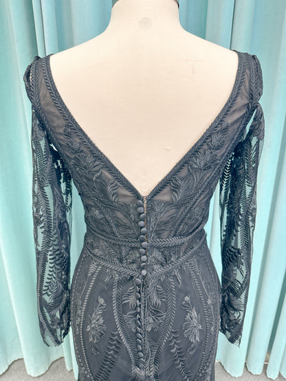 Morticia Mermaid Wedding Dress in Black, Size 12 — embroidered lace, plunging V-neckline, long illusion sleeves