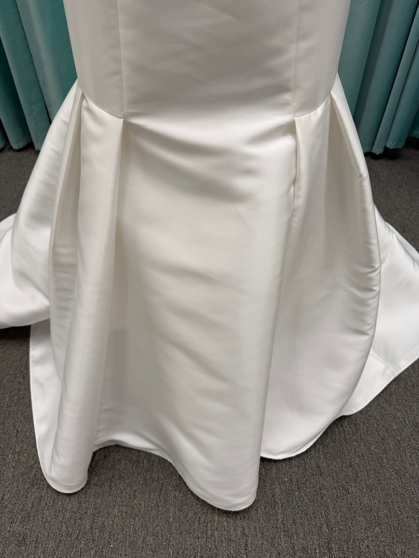 Modest Mikado fit-and-flare wedding dress with square neckline, low scoop back, and dramatic detachable bow train