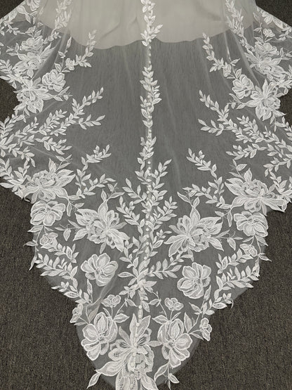 Essense of Australia D4037 crepe sheath wedding dress with plunging V-neckline, sheer lace bodice, side cutouts, and low back with lace train