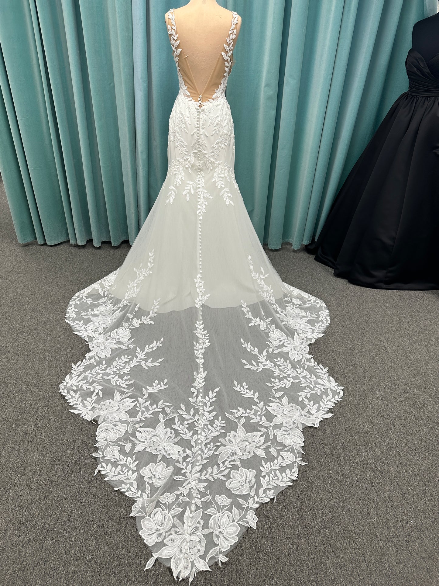 Essense of Australia D4037 crepe sheath wedding dress with plunging V-neckline, sheer lace bodice, side cutouts, and low back with lace train