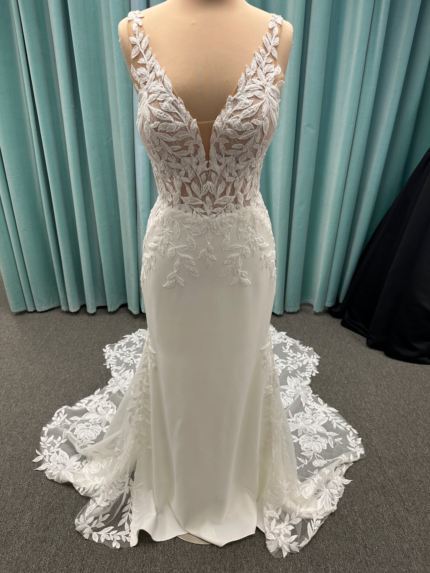 Essense of Australia D4037 crepe sheath wedding dress with plunging V-neckline, sheer lace bodice, side cutouts, and low back with lace train