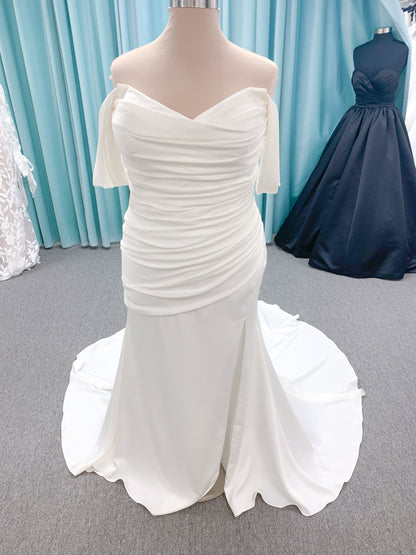 Morilee 4473 Reba plus size A-line wedding dress in Larissa satin with cowl strapless neck, detachable organza bow tie straps, and covered buttons to hem.