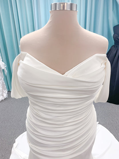 Morilee 4473 Reba plus size A-line wedding dress in Larissa satin with cowl strapless neck, detachable organza bow tie straps, and covered buttons to hem.