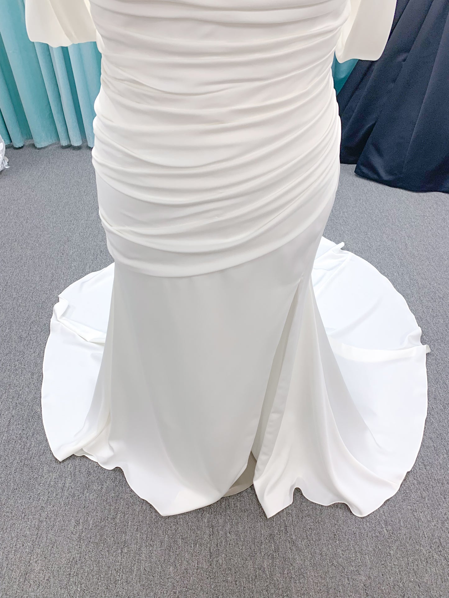 Morilee 4473 Reba plus size A-line wedding dress in Larissa satin with cowl strapless neck, detachable organza bow tie straps, and covered buttons to hem.